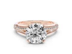 Round Cut Diamond Split Shank Pavé Engagement Ring Set in Rose gold with Prong-Set Center Stone