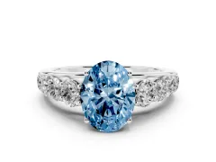 Fancy Blue Oval Cut Diamond Solitaire Ring Set in White gold with Pavé-Set Band and Prong Setting