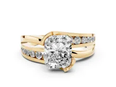 Radiant Cut Diamond Solitaire Ring Set in Yellow gold with Channel Set Split Shank and Tension Prongs