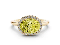 Fancy Yellow Oval Cut Diamond Halo Engagement Ring Set in Yellow gold with Pavé Band and Rising Shoulders