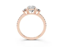 Cushion Cut Diamond Three-Stone Ring Set in Rose gold with Pavé Band and Graduated Sides