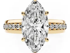 Marquise Cut Diamond Solitaire Ring Set in Yellow gold with Channel Set Band and Prong Setting