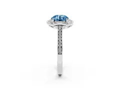 Fancy Blue Round Cut Diamond Halo Ring Set in Platinum with Pavé-Lined Shoulders and Prong Setting