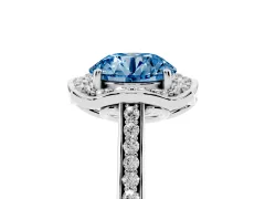Fancy Blue Round Cut Diamond Halo Ring Set in Platinum with Pavé-Lined Shoulders and Prong Setting