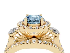 Fancy Blue Oval Cut Diamond Halo Split Shank Ring Set in Yellow gold with Round Accent Stones and Prong Setting