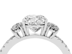 Cushion Cut Diamond Three-Stone Ring Set in Platinum with Pavé Band and Graduated Sides