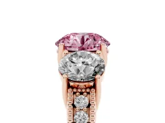 Fancy Pink Round Cut Diamond Three-Stone Engagement Ring Set in Rose gold with Milgrain Pavé Band