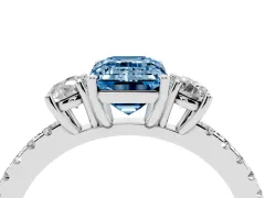 Fancy Blue Emerald Cut Diamond Three-Stone Ring Set in Platinum with Pavé Band and Graduated Sides