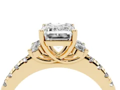 Emerald Cut Diamond Three-Stone Pavé Ring Set in Yellow gold with Prong Setting