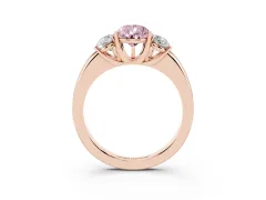 Fancy Pink Pear Cut Diamond Three-Stone Ring Set in Rose gold with Bold Center and Classic Band