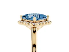 Fancy Blue Princess Cut Diamond Halo Engagement Ring Set in Yellow gold with Pavé Band and Rising Shoulders