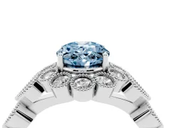 Fancy Blue Oval Cut Diamond Solitaire Ring Set in Platinum with Milgrain Pavé Heart Band
