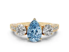 Fancy Blue Pear Cut Diamond Three-Stone Ring Set in Yellow gold with Round Side Stones and Pavé Band