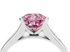 Fancy Pink Cushion Cut Diamond Bezel-Set Solitaire Ring Set in White gold with Channel-Set Band