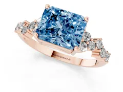 Fancy Blue Radiant Cut Diamond Ring Set in Rose gold with Scattered Round Accents