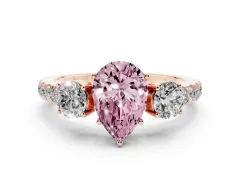 Fancy Pink Pear Cut Diamond Three-Stone Ring Set in Rose gold with Round Side Stones and Delicate Pavé Band