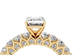 Emerald Cut Diamond Solitaire Ring Set in Yellow gold with Shared Prong Pavé Band