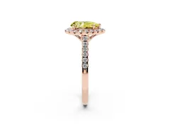 Fancy Yellow Pear Cut Diamond Pavé Halo Engagement Ring Set in Rose gold with Pavé Band and Prong Setting