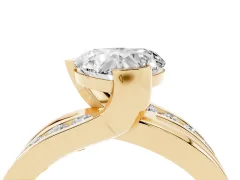 Heart Cut Diamond Solitaire Ring Set in Yellow gold with Channel Set Split Shank and Tension Prongs
