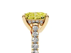 Fancy Yellow Radiant Cut Diamond Solitaire Ring Set in Yellow gold with Brilliant Pavé Band and Prong Setting