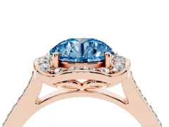 Fancy Blue Round Cut Diamond Halo Ring Set in Rose gold with Pavé-Lined Shoulders and Prong Setting