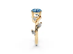 Fancy Blue Round Cut Diamond Solitaire Ring Set in Yellow gold with Twisted Marquise Accent Band