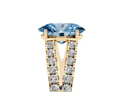 Fancy Blue Oval Cut Diamond Split Shank Pavé Engagement Ring Set in Yellow gold with Prong-Held Center Stone