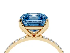 Fancy Blue Asscher Cut Diamond Solitaire Engagement Ring Set in Yellow gold with Round Pavé Band and Prong Setting
