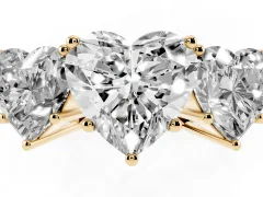 Heart Cut Diamond Three-Stone Ring Set in Yellow gold with Textured Band