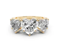 Heart Cut Diamond Three-Stone Ring Set in Yellow gold with Textured Band