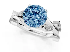 Fancy Blue Round Cut Diamond Solitaire Ring Set in Platinum with Twisted Marquise Accent Band