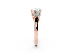 Heart Cut Diamond Three-Stone Ring Set in Rose gold with Channel-Set Band and Prong Settings