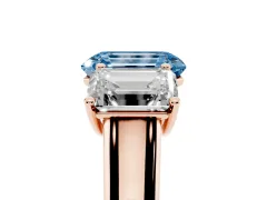 Fancy Blue Emerald Cut Diamond Three-Stone Ring Set in Rose gold with Plain Polished Band