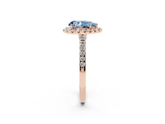 Fancy Blue Pear Cut Diamond Halo Pavé Engagement Ring Set in Rose gold with Prong Setting