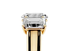 Emerald Cut Diamond Three-Stone Ring Set in Yellow gold with Plain Polished Band