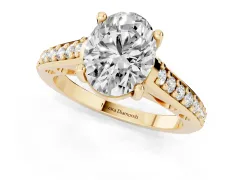 Oval Cut Diamond Prong Set Solitaire Engagement Ring Set in Yellow gold with Pavé Band
