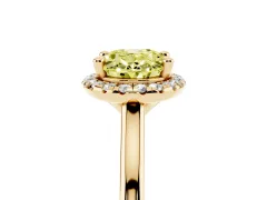 Fancy Yellow Oval Cut Diamond Halo Engagement Ring Set in Yellow gold with Pavé Band and Rising Shoulders