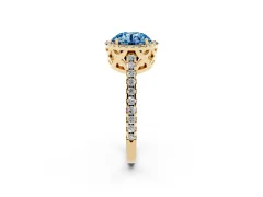 Fancy Blue Round Cut Diamond Halo Ring Set in Yellow gold with Pavé Shoulders and Halo-Framed Center