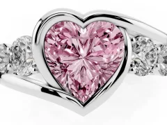 Fancy Pink Heart Cut Diamond Bezel Bypass Ring Set in White gold with Round Accents