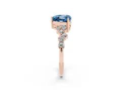 Fancy Blue Heart Cut Diamond Ring Set in Rose gold with Scattered Round Accents