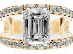 Emerald Cut Diamond Split Shank Pavé Solitaire Ring Set in Yellow gold with Open Shank Design