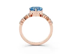 Fancy Blue Heart Cut Diamond Ring Set in Rose gold with Scattered Round Accents