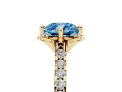Fancy Blue Cushion Cut Diamond Solitaire Ring Set in Yellow gold with Pavé Band and Floral Prong Setting