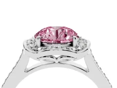 Fancy Pink Round Cut Diamond Halo Ring Set in White gold with Pavé-Lined Shoulders and Prong Setting