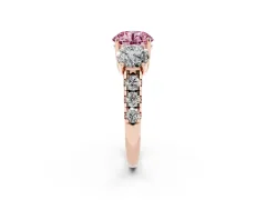 Fancy Pink Round Cut Diamond Three-Stone Ring Set in Rose gold with Pavé Band