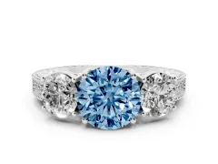 Fancy Blue Round Cut Diamond Three-Stone Engagement Ring Set in White gold with Milgrain Pavé Band