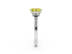 Fancy Yellow Oval Cut Diamond Three-Stone Pavé Ring Set in White gold with Prong Setting