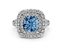 Fancy Blue Round Cut Diamond Double Halo Ring Set in White gold with Pavé Split Shank and Prong Setting
