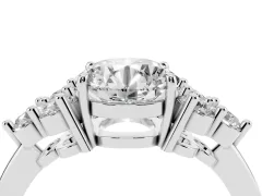 Round Cut Diamond Solitaire Ring Set in Platinum with Cluster Accents on Each Side