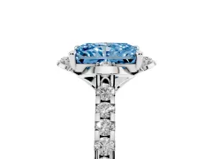 Fancy Blue Radiant Cut Diamond Solitaire Ring Set in Silver with Pavé Band and Floral Prong Setting